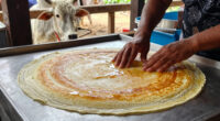 Dosa seller prepares Dosa for Cow that regularly visits his stall